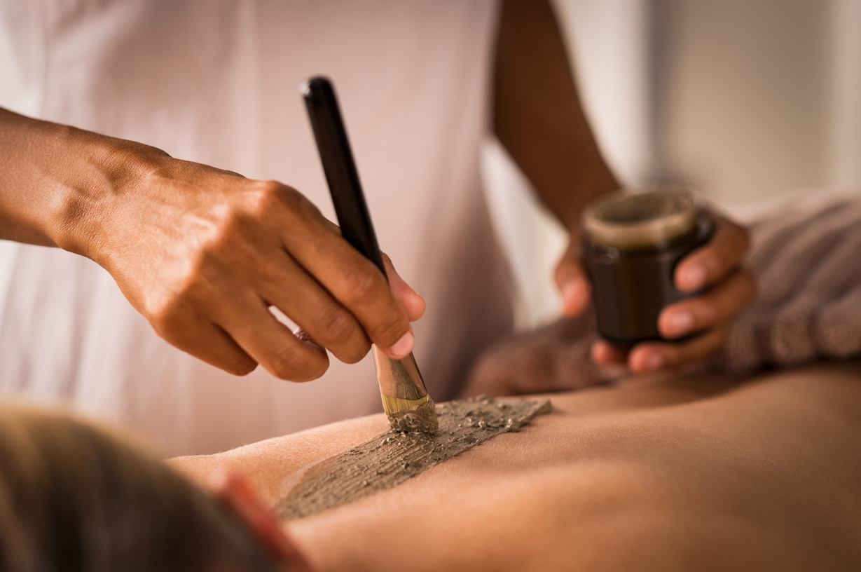 Beautician Applying Mud on Body