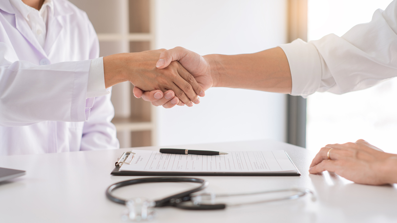 Doctor and Patient Shaking Hands